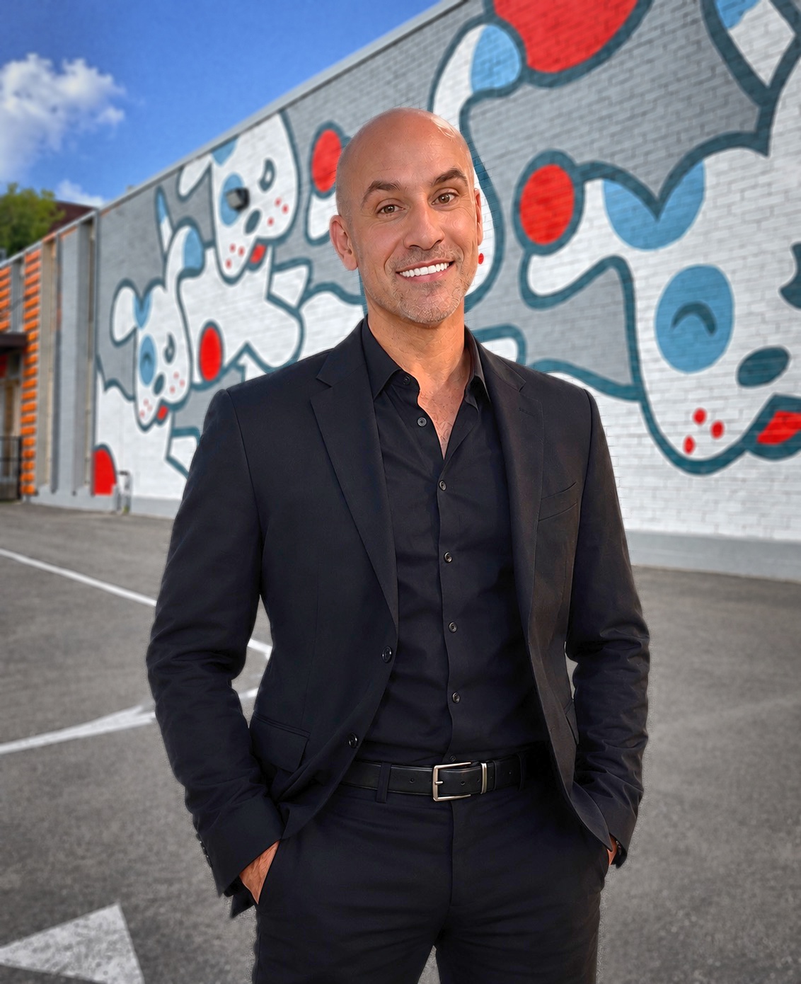 Nathan Rao in front of the Wag’n World mural in Houston